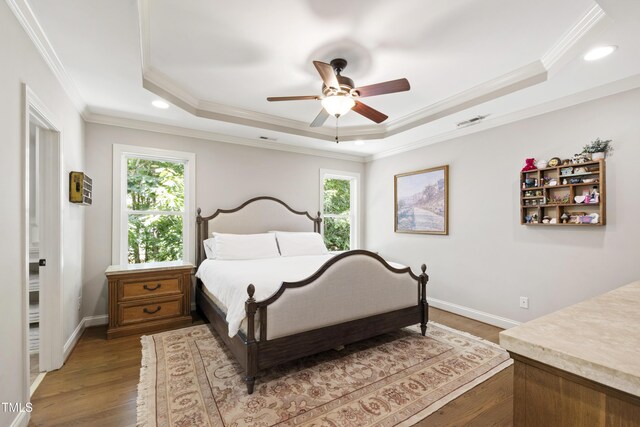 101 Eden Glen Dr, Holly Springs, NC 27540 - bedroom featuring a tray ceiling, crown molding, light wood-type flooring, recessed lighting, and baseboards