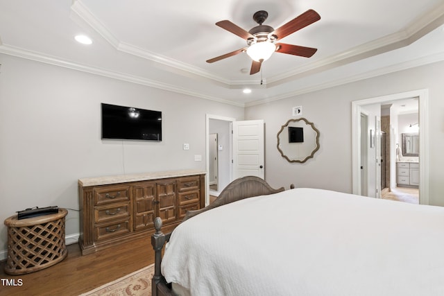 101 Eden Glen Dr, Holly Springs, NC 27540 - bedroom featuring a tray ceiling, recessed lighting, crown molding, wood finished floors, and connected bathroom