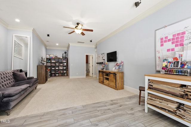 101 Eden Glen Dr, Holly Springs, NC 27540 - living area featuring ornamental molding, a ceiling fan, baseboards, light wood finished floors, and recessed lighting