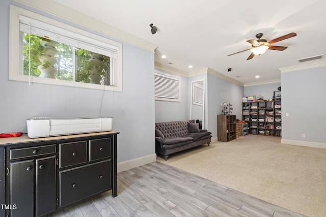 101 Eden Glen Dr, Holly Springs, NC 27540 - sitting room with a ceiling fan, ornamental molding, baseboards, light wood-style floors, and recessed lighting