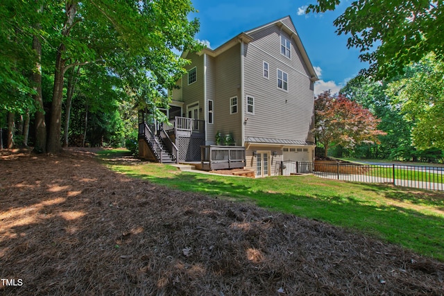 101 Eden Glen Dr, Holly Springs, NC 27540 - back of house with stairs, a garage, a wooden deck, and concrete driveway