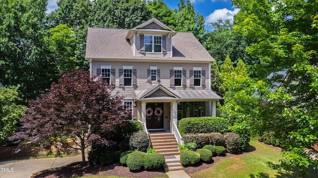 101 Eden Glen Dr, Holly Springs, NC 27540 - colonial house featuring roof with shingles and view of wooded area