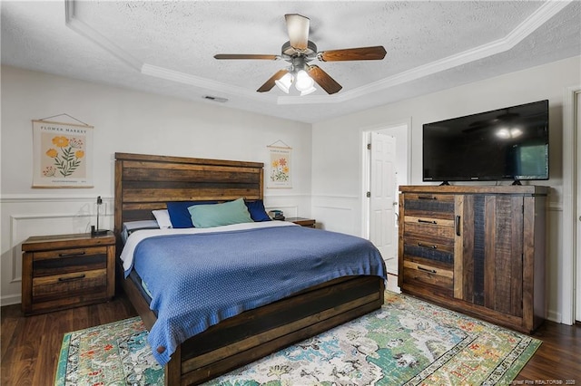 101 Quiet Cv, Raeford, NC 28376 - bedroom featuring a textured ceiling, wood finished floors, a raised ceiling, a ceiling fan, and crown molding