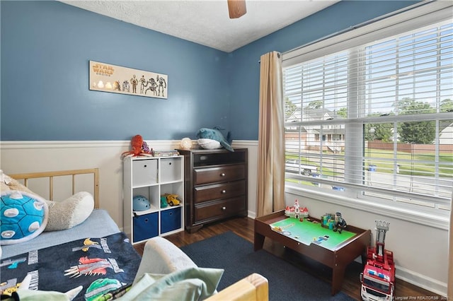 101 Quiet Cv, Raeford, NC 28376 - recreation room featuring wood finished floors, wainscoting, ceiling fan, and a textured ceiling