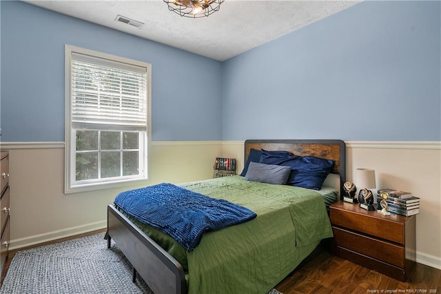 101 Quiet Cv, Raeford, NC 28376 - bedroom featuring baseboards, wood finished floors, and a textured ceiling