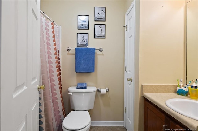 101 Quiet Cv, Raeford, NC 28376 - bathroom featuring vanity, toilet, and baseboards