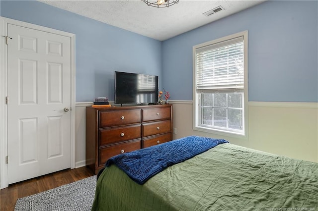 101 Quiet Cv, Raeford, NC 28376 - bedroom with wood finished floors and a textured ceiling