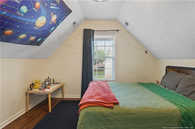 101 Quiet Cv, Raeford, NC 28376 - bedroom with wood finished floors, a textured ceiling, lofted ceiling, and baseboards
