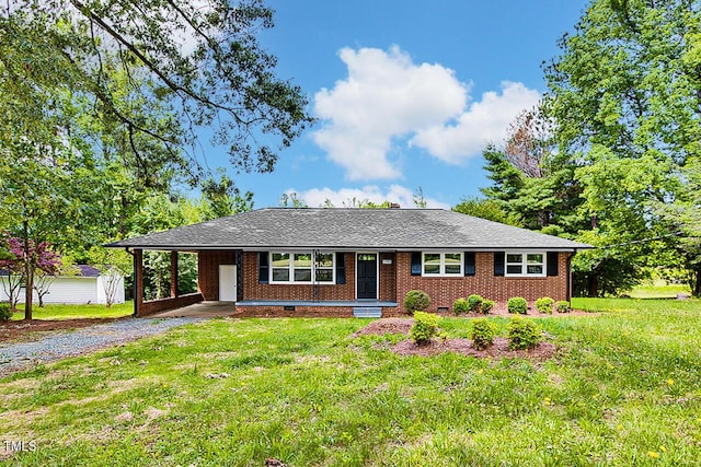 1592 Boone Rd, Elon, NC 27244 - single story home with gravel driveway, a front lawn, an attached carport, and brick siding