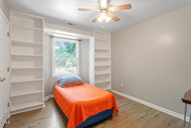 2010 Quaker Lndg Unit 102, Raleigh, NC 27603 - bedroom featuring wood finished floors, baseboards, and a ceiling fan