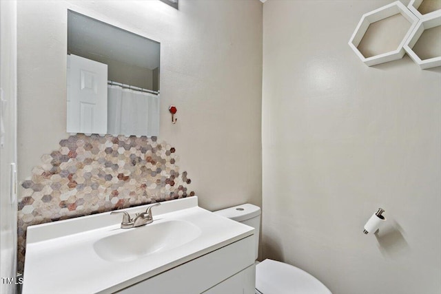 2010 Quaker Lndg Unit 102, Raleigh, NC 27603 - bathroom featuring vanity and toilet
