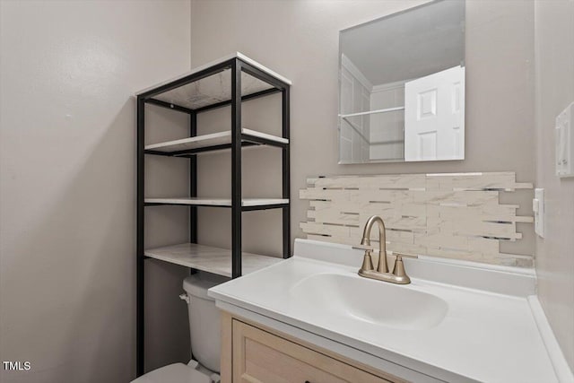 2010 Quaker Lndg Unit 102, Raleigh, NC 27603 - bathroom with toilet, vanity, and backsplash