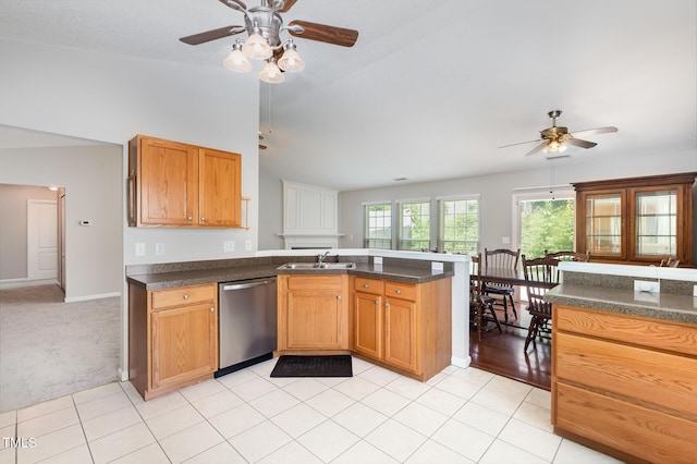 503 Kinship Ln, Apex, NC 27502 - kitchen with dishwasher, a ceiling fan, a sink, dark countertops, and vaulted ceiling
