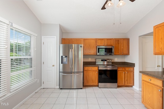 503 Kinship Ln, Apex, NC 27502 - kitchen featuring appliances with stainless steel finishes, ceiling fan, light tile patterned floors, and baseboards