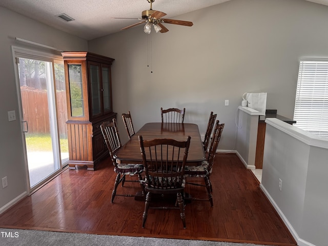 503 Kinship Ln, Apex, NC 27502 - dining area featuring vaulted ceiling, wood finished floors, ceiling fan, baseboards, and a textured ceiling