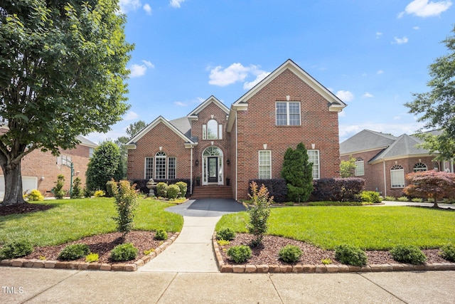 12140 Pawleys Mill Cir, Raleigh, NC 27614 - traditional-style home featuring brick siding and a front yard