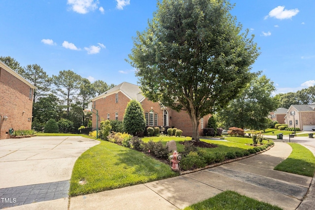12140 Pawleys Mill Cir, Raleigh, NC 27614 - view of home's exterior featuring brick siding and a lawn