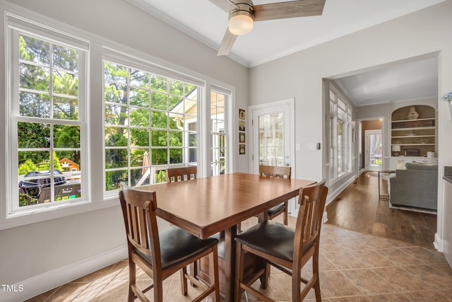12140 Pawleys Mill Cir, Raleigh, NC 27614 - dining room with crown molding, a ceiling fan, baseboards, and tile patterned flooring