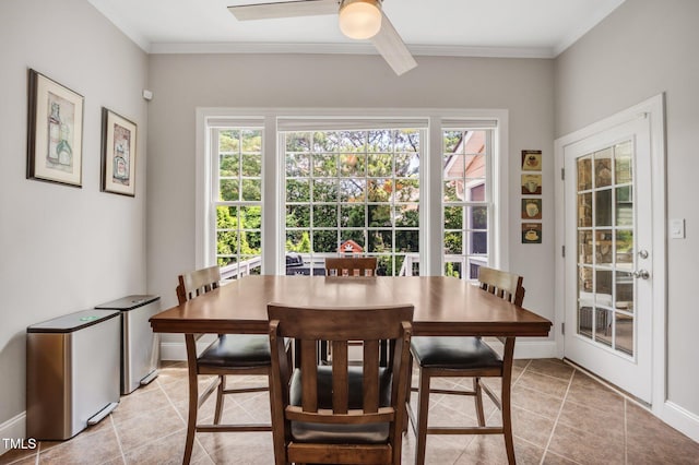 12140 Pawleys Mill Cir, Raleigh, NC 27614 - dining space featuring plenty of natural light, a ceiling fan, light tile patterned flooring, crown molding, and baseboards