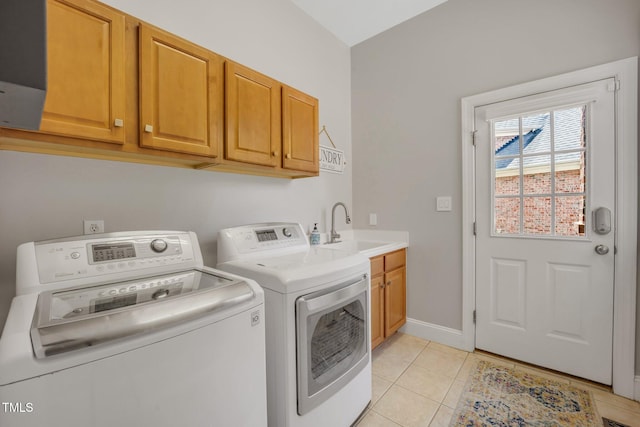 12140 Pawleys Mill Cir, Raleigh, NC 27614 - washroom with cabinet space, washer and clothes dryer, light tile patterned floors, and baseboards