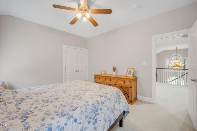 12140 Pawleys Mill Cir, Raleigh, NC 27614 - bedroom with light carpet, a chandelier, a closet, lofted ceiling, and ceiling fan