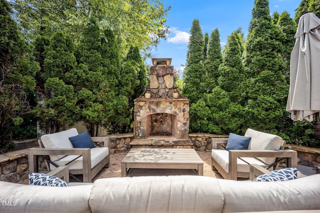 12140 Pawleys Mill Cir, Raleigh, NC 27614 - view of patio / terrace with an outdoor living space with a fireplace