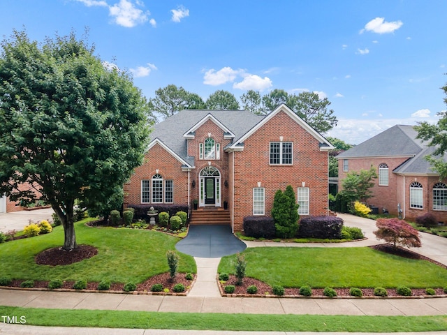 12140 Pawleys Mill Cir, Raleigh, NC 27614 - view of front of home featuring brick siding and a front lawn
