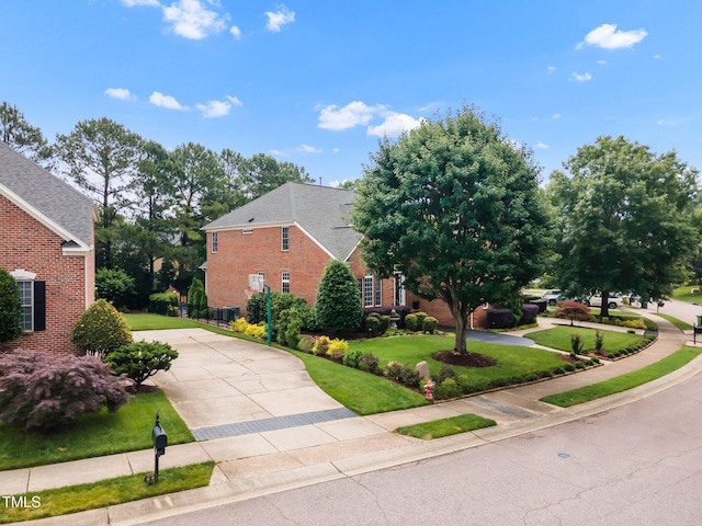 12140 Pawleys Mill Cir, Raleigh, NC 27614 - view of front of property with brick siding, concrete driveway, and a front yard