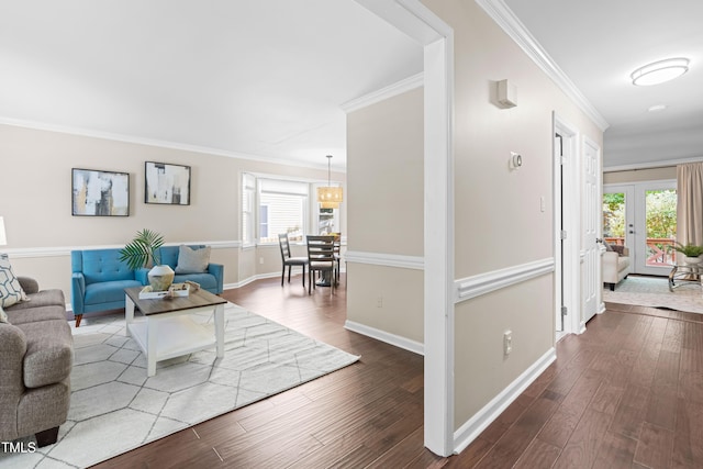 6104 New Market Way, Raleigh, NC 27609 - living area with ornamental molding, dark wood-style floors, and baseboards