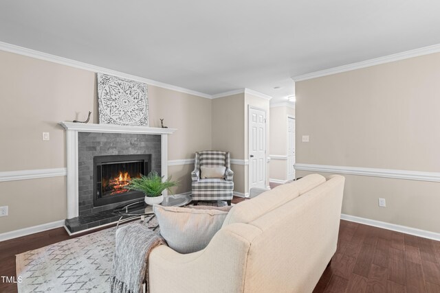 6104 New Market Way, Raleigh, NC 27609 - living area featuring dark wood-style flooring, a warm lit fireplace, ornamental molding, and baseboards