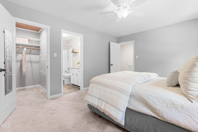 6104 New Market Way, Raleigh, NC 27609 - bedroom featuring a spacious closet, a closet, baseboards, light colored carpet, and ensuite bathroom