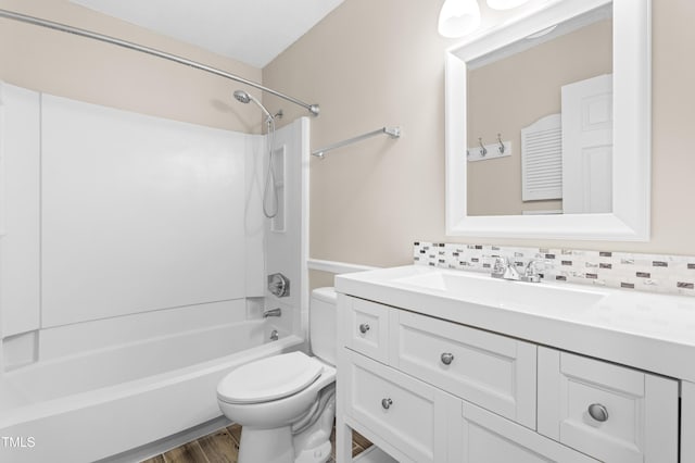 6104 New Market Way, Raleigh, NC 27609 - full bath with toilet, vanity, bathing tub / shower combination, wood finished floors, and decorative backsplash