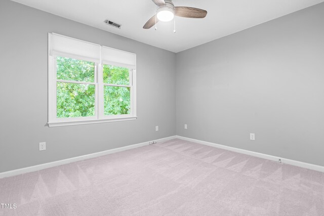 6104 New Market Way, Raleigh, NC 27609 - empty room featuring light colored carpet, a ceiling fan, and baseboards