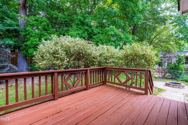 6104 New Market Way, Raleigh, NC 27609 - wooden deck featuring an outdoor fire pit