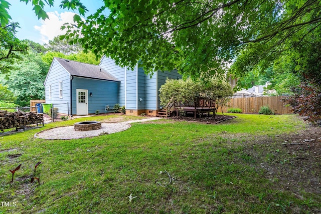 6104 New Market Way, Raleigh, NC 27609 - view of yard with an outdoor fire pit and a wooden deck