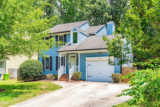 6104 New Market Way, Raleigh, NC 27609 - view of front facade featuring a shingled roof, a chimney, a garage, and driveway