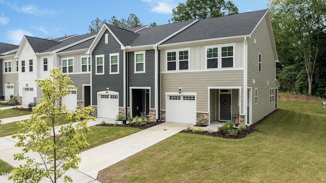 1615 Emory Ridge Way, Wake Forest, NC 27587 - multi unit property featuring board and batten siding, a front yard, a garage, and stone siding