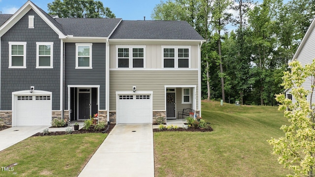 1615 Emory Ridge Way, Wake Forest, NC 27587 - view of front of property featuring a front lawn, stone siding, concrete driveway, and a garage
