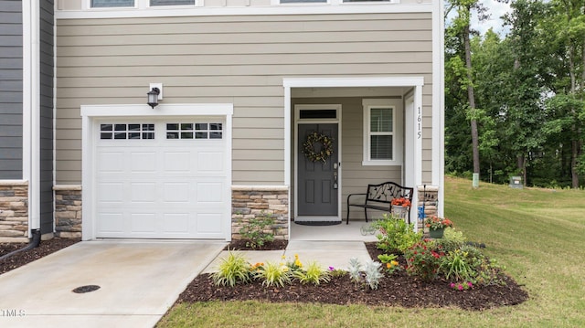 1615 Emory Ridge Way, Wake Forest, NC 27587 - entrance to property featuring stone siding, an attached garage, a yard, driveway, and a porch