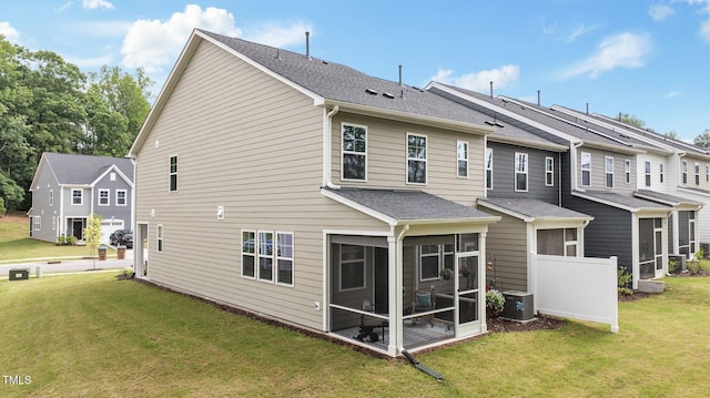 1615 Emory Ridge Way, Wake Forest, NC 27587 - rear view of property featuring a sunroom, a lawn, and a shingled roof