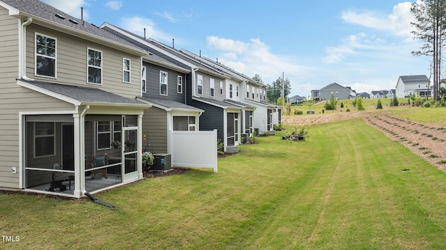 1615 Emory Ridge Way, Wake Forest, NC 27587 - view of grassy yard with a residential view, a sunroom, and cooling unit