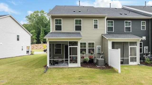 1615 Emory Ridge Way, Wake Forest, NC 27587 - rear view of house with a sunroom, a lawn, central AC unit, and a shingled roof