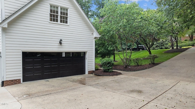 1332 Kinsdale Dr, Raleigh, NC 27615 - view of side of home with concrete driveway and an attached garage