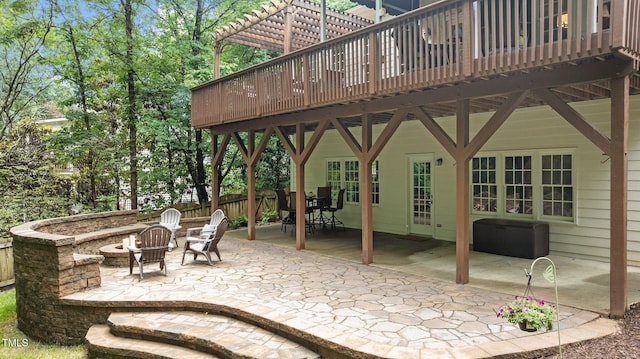1332 Kinsdale Dr, Raleigh, NC 27615 - view of patio with a fire pit, a wooden deck, outdoor dining space, and a pergola