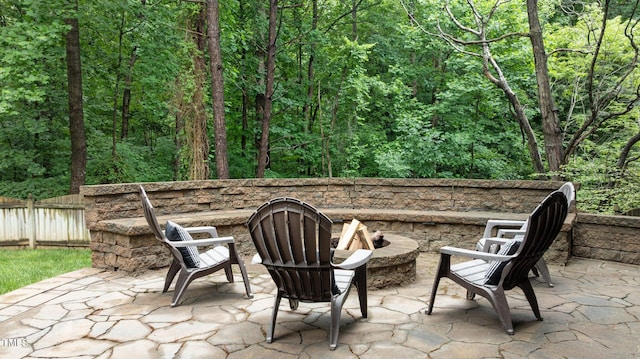 1332 Kinsdale Dr, Raleigh, NC 27615 - view of patio / terrace with a fire pit and a wooded view