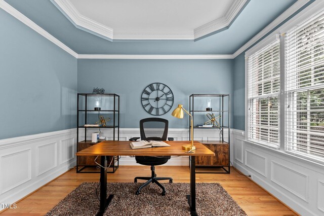 1332 Kinsdale Dr, Raleigh, NC 27615 - office featuring a raised ceiling, crown molding, light wood-style flooring, and a wainscoted wall