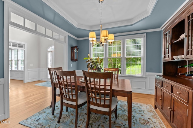 1332 Kinsdale Dr, Raleigh, NC 27615 - dining area with a raised ceiling, a chandelier, a wainscoted wall, a decorative wall, and crown molding