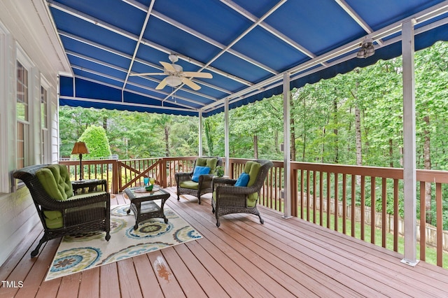 1332 Kinsdale Dr, Raleigh, NC 27615 - wooden deck with an outdoor living space, a ceiling fan, and a forest view