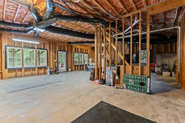 1332 Kinsdale Dr, Raleigh, NC 27615 - miscellaneous room featuring healthy amount of natural light and unfinished concrete flooring