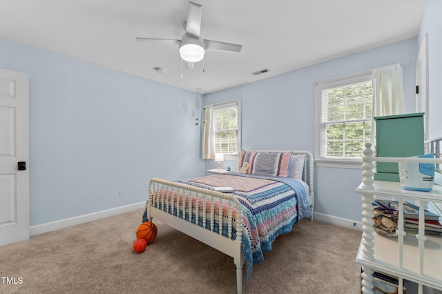 1332 Kinsdale Dr, Raleigh, NC 27615 - carpeted bedroom with baseboards and ceiling fan